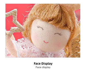 Detailed macro view of the embroidered face on a handmade long-legged angel doll charm