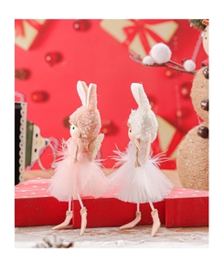 Detail of pink and white bunny ear Christmas doll pendants with lace skirts and wings