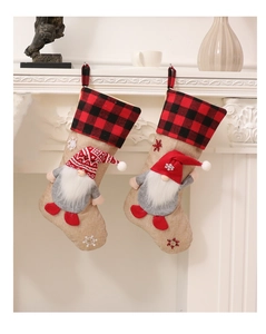 Detail of burlap Christmas stockings with 3D gnomes and buffalo plaid cuffs