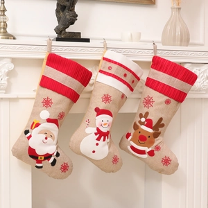 Hanging burlap Christmas stockings with embroidered Santa, Snowman and Reindeer patterns