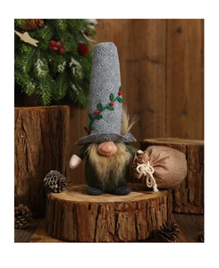 Detail of Christmas gnome with grey embroidered hat and burlap bag on wooden base