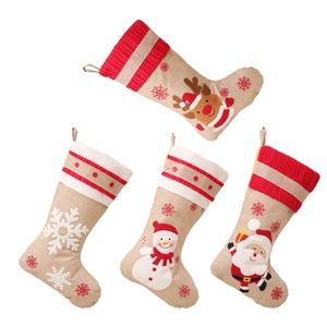 Set of 4 rustic burlap Christmas stockings featuring Santa, Snowman, Reindeer, and Snowflake