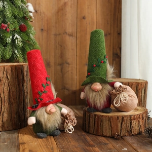 Handcrafted Christmas gnomes with knit hats and faux fur beards on rustic wood background