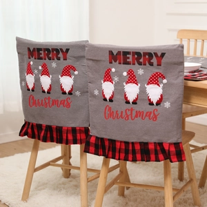 Christmas chair cover featuring grey fabric with gnomes and red plaid ruffled trim