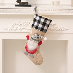 Christmas stocking with gnome and snowflake design for festive home decor and gift bag