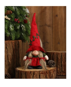 Detail of Christmas gnome with spiral embroidery and berry accents in festive setting