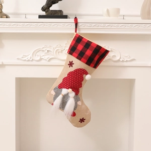 Nordic Christmas stocking with gnome patch on beige burlap and buffalo plaid cuff