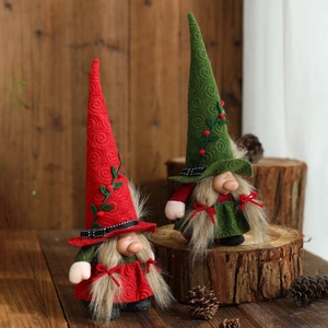 Red and green Christmas gnomes with spiral pointed hats and holly berry embroidery