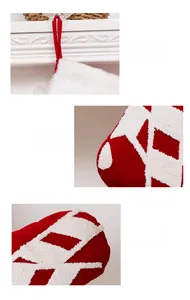 Detail of Christmas stocking featuring white towel embroidery and plush cuff with a velvet loop
