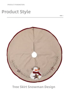 Detail of burlap Christmas tree skirt featuring snowman embroidery and JOY star ornament