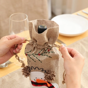 Linen Christmas wine bottle gift bag with embroidered snowman and fur ball drawstrings