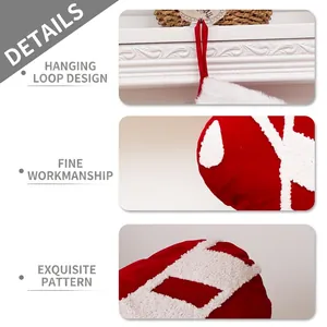 Dark red velvet Christmas stocking with white snowflake embroidery and hanging loop design