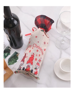 Detail of Christmas gnome wine bag with plaid drawstring and festive decoration