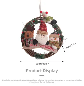 Detailed view of a 32cm Christmas rattan wreath with Santa, reindeer, and pine berry decor