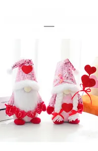 Close-up of Valentine Gnomes with pink sequins, love banners and plush heart decorations