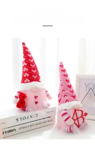 Close-up of glowing Valentine's Day gnomes with pink beards holding a rose and love bow