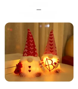 Luminous Valentine's Day gnomes with LED lights, holding a rose and heart bow in a warm setting