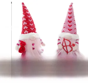 Detail of LED Valentine gnomes with rose and heart bow in pink and red plush materials