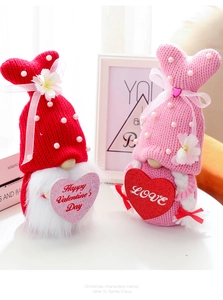 Detail of knitted Valentine's Gnomes with bunny ears and Happy Valentine's Day heart signs