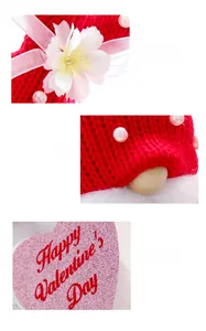 Detail of knitted Valentine's gnome with pearls, fabric flower and pink glitter heart icon