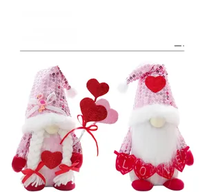 Detail of sequined Valentine's gnomes with plush beards and LOVE heart banner decor