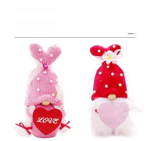 Detail of knitted Valentine's Day gnomes with LOVE and Happy Valentine's Day hearts