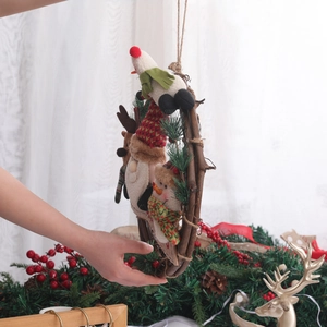Christmas wreath with plush Santa, Snowman, and Reindeer on a natural rattan ring