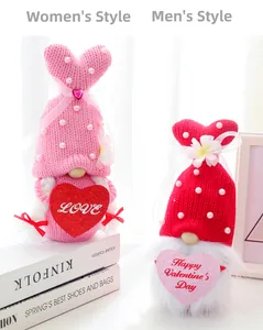 Detail of knitted Valentine Gnomes with bunny ears and Love heart signs on books