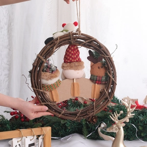Christmas wreath with plush Santa and elves on natural rattan wood circle decoration