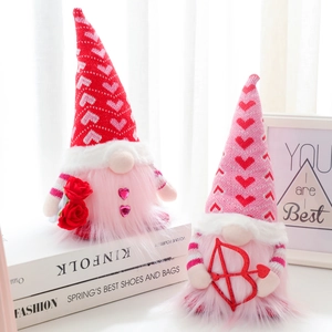 Set of two glowing Valentine's Day gnomes with rose and heart on decorative books