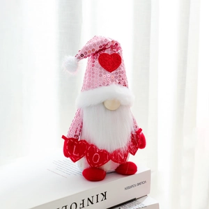 Valentine gnome with pink sequin hat and LOVE banner on white decorative books