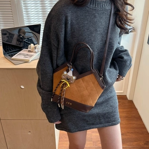 Quilted suede bucket bag in leopard print retro style with teddy bear charm for women