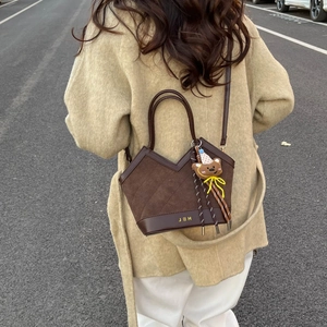 Retro leopard print suede bucket bag with leather strap and cute bear keychain accessory