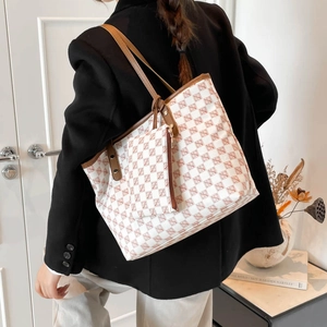Minimalist vintage tote bag with monogram pattern and matching small pouch