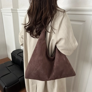 Minimalist vintage coffee brown velvet tote bag in slouchy hobo style shown on model