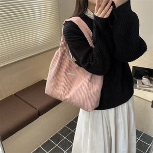 Minimalist pink pleated tote bag with fashion tag for women showing large capacity