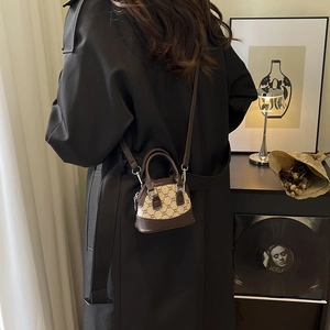 Mini shell-shaped crossbody bag in vintage monogram pattern with brown leather trim