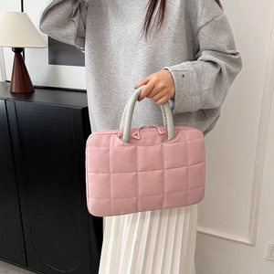 Pink quilted 14 inch laptop tote bag with soft green handles and zip closure