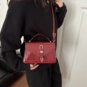 Deep red crocodile embossed crossbody bag with gold buckle for stylish women's fashion