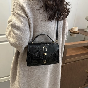 Minimalist black crocodile pattern handbag for women with golden metal buckle and shoulder strap