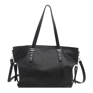 Classic large black leather tote bag with silver star rivets and long shoulder straps