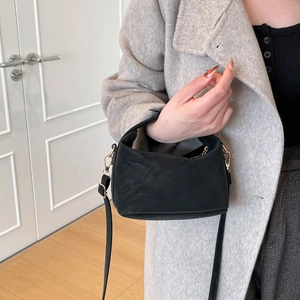 Classic black leather crossbody tote bag with gold hardware for women's daily commute