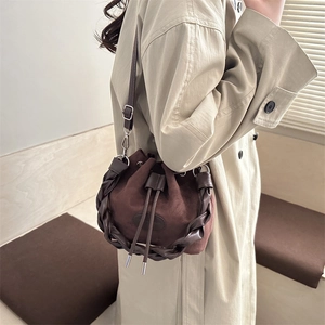 Retro dark brown suede bucket bag with leather braided strap and drawstring closure