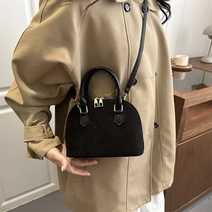 Classic black shell bag with clover embossing and gold hardware for women