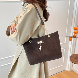 Large brown suede tote bag for women with golden deer charm and chain shoulder strap