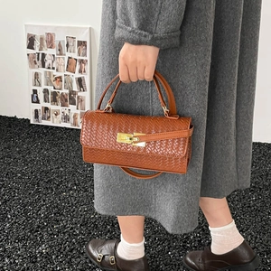 Brown woven texture leather handbag with gold twist lock and crossbody strap
