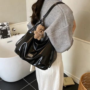 Large black glossy patent leather Hobo shoulder bag with cute brown bear charm accessory