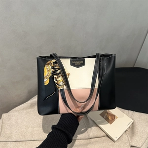 Close-up of tricolor tote bag with floral silk scarf detail and high-quality stitching