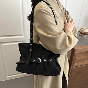 Elegant black suede shoulder bag with vintage silver buckles and adjustable strap