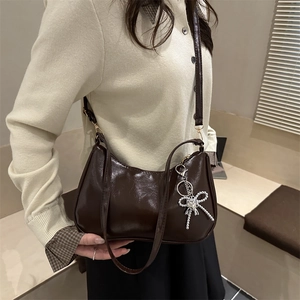 Chic dark brown hobo underarm bag with silver heart charm and smooth glossy finish